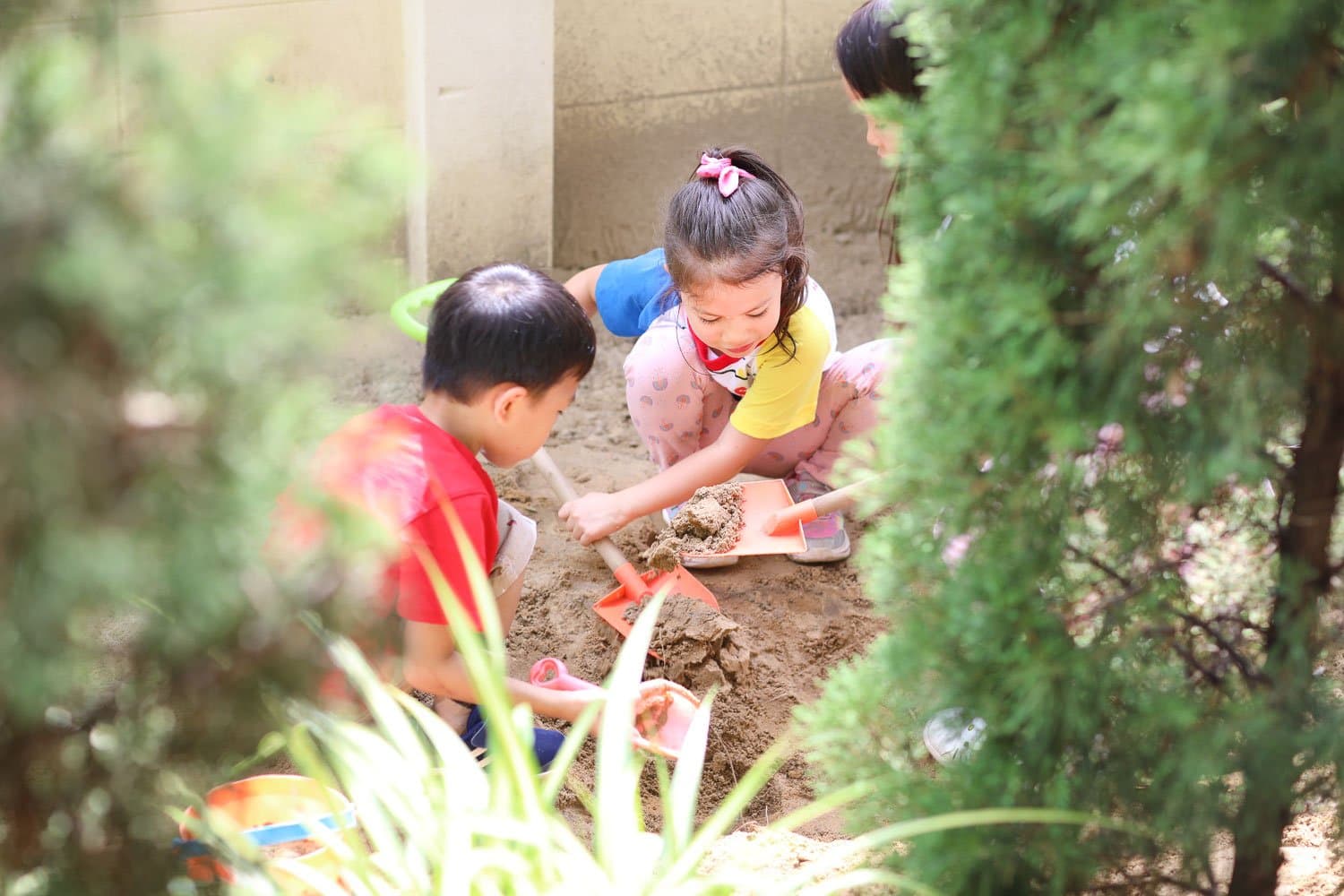 Children playing in the garden at Little Joy Preschool, Bangkok